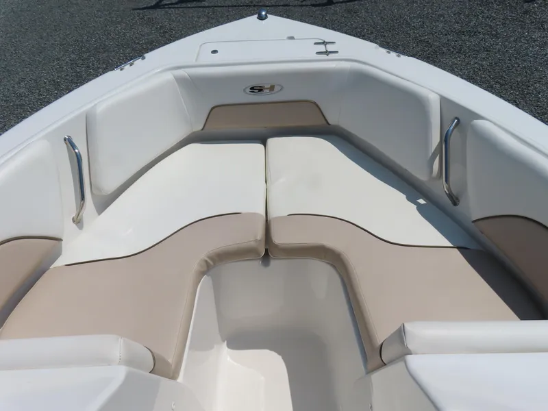 Slide: The Image of 2013 Sea Hunt Escape 211 LE boat interior with cushioned seating. - 7
