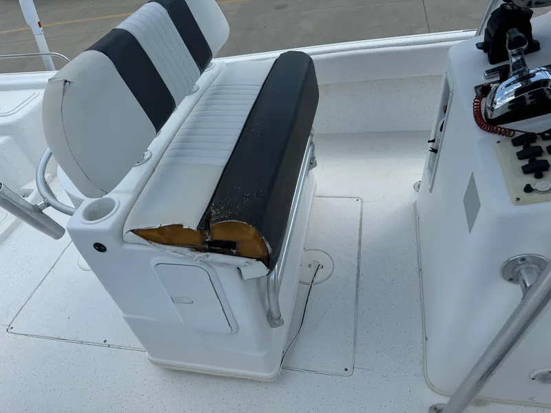 Slide: The Image of 2011 Carolina Skiff 25 Elite SS boat seat with visible wear and tear. - 11