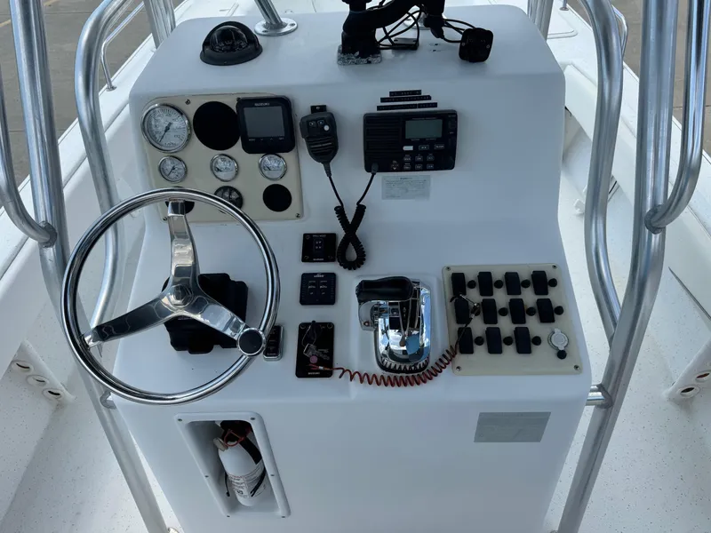Slide: The Image of Control panel of 2011 Carolina Skiff 25 Elite SS with steering wheel and gauges. - 7