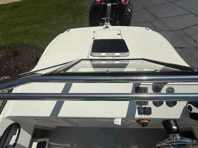 Slide: The Image of 1998 Kevlacat Series 2000 Cuddy Cabin OB boat dashboard with steering wheel and gauges. - 11