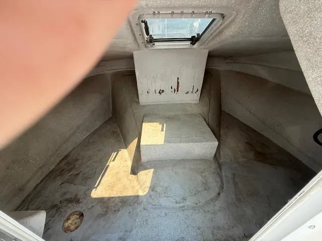 Slide: The Image of 1998 Kevlacat Series 2000 Cuddy Cabin interior with hatch and seating area. - 13
