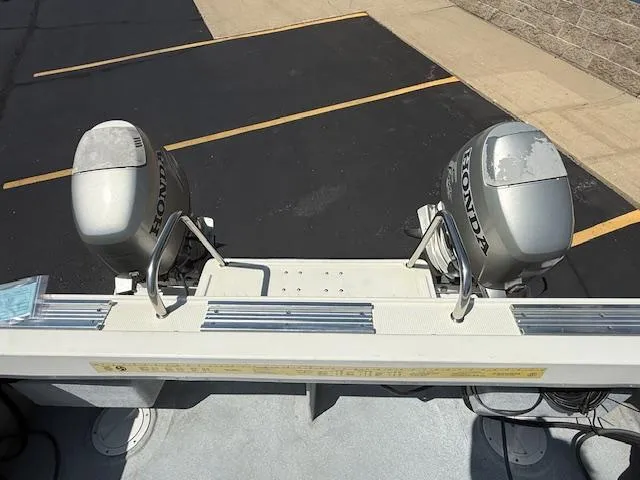 Slide: The Image of 1998 Kevlacat Series 2000 Cuddy Cabin OB with dual Honda outboard motors. - 15