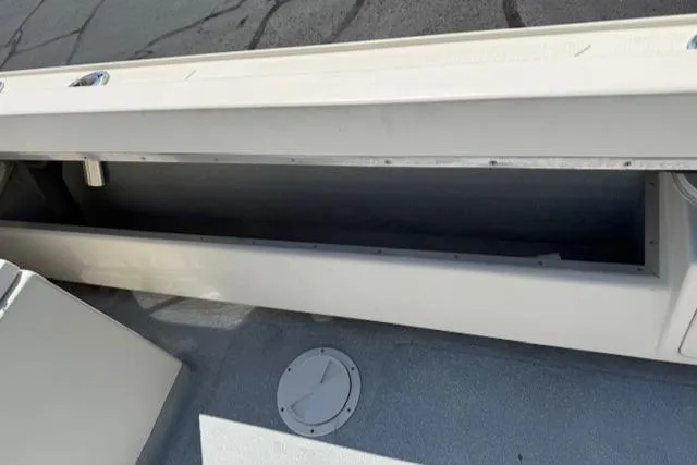 Slide: The Image of 1998 Kevlacat Series 2000 Cuddy Cabin OB boat storage compartment, open and empty. - 17