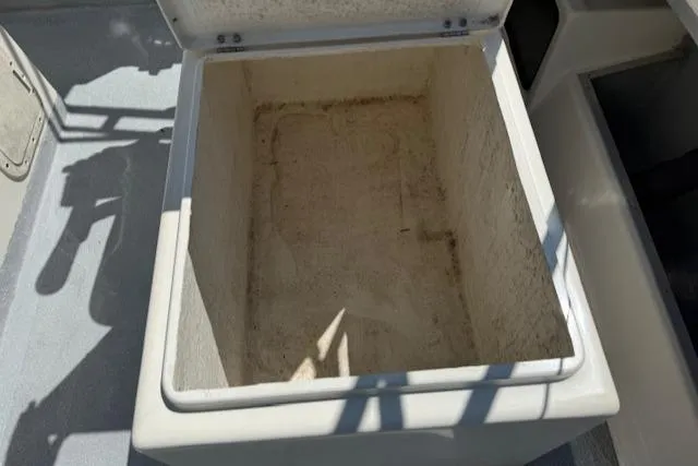 Slide: The Image of Open storage compartment on 1998 Kevlacat Series 2000 Cuddy Cabin boat. - 18