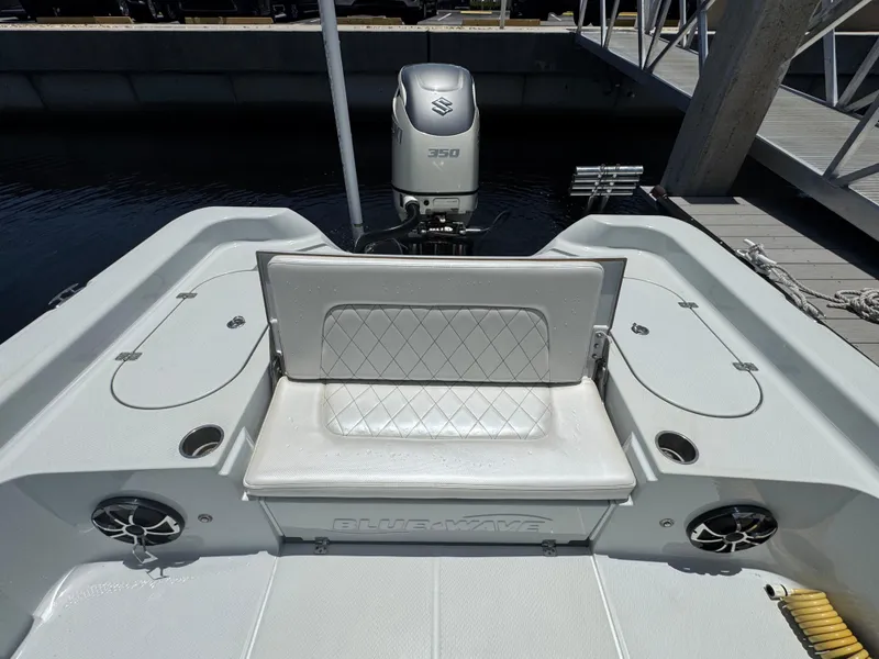 Slide: The Image of 2019 Blue Wave 2800 Pure Hybrid boat with Suzuki 350 engine at dock. - 15