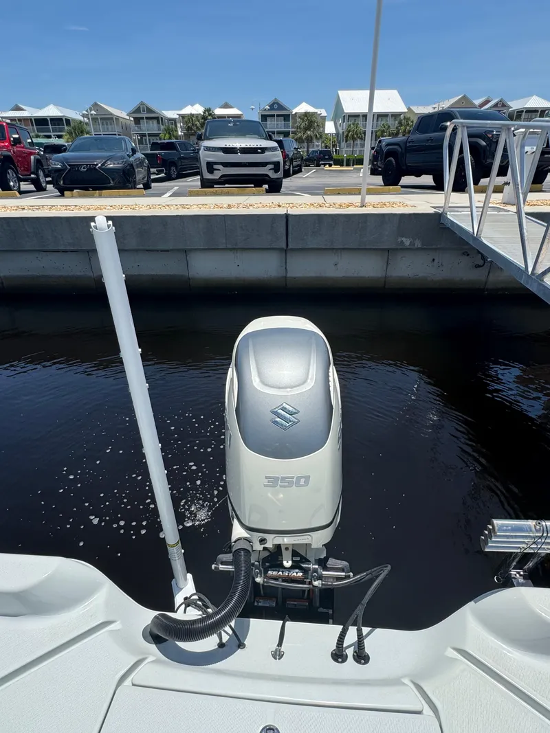 Slide: The Image of 2019 Blue Wave 2800 Pure Hybrid boat with Suzuki 350 outboard motor at dock. - 19
