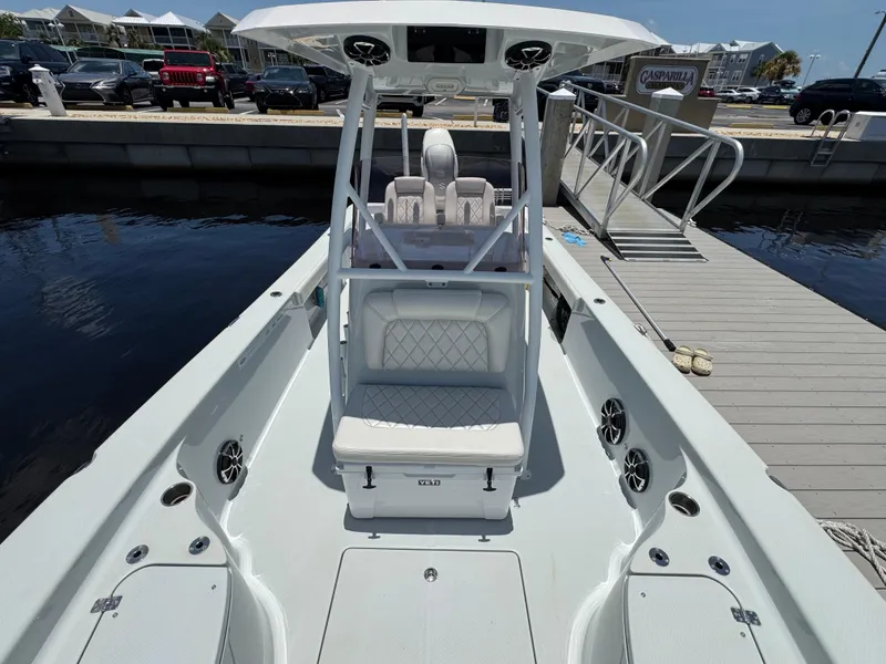 Slide: The Image of 2019 Blue Wave 2800 Pure Hybrid boat docked at marina, featuring spacious seating and modern design. - 9