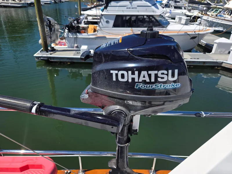 Slide: The Image of Tohatsu FourStroke outboard motor on a 1989 Eagle Pilothouse boat at marina. - 21
