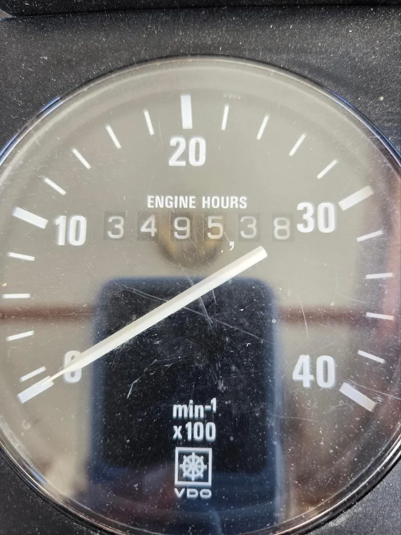 Slide: The Image of Close-up of a VDO engine hour meter showing 3495.38 hours on an Eagle Pilothouse 1989. - 34