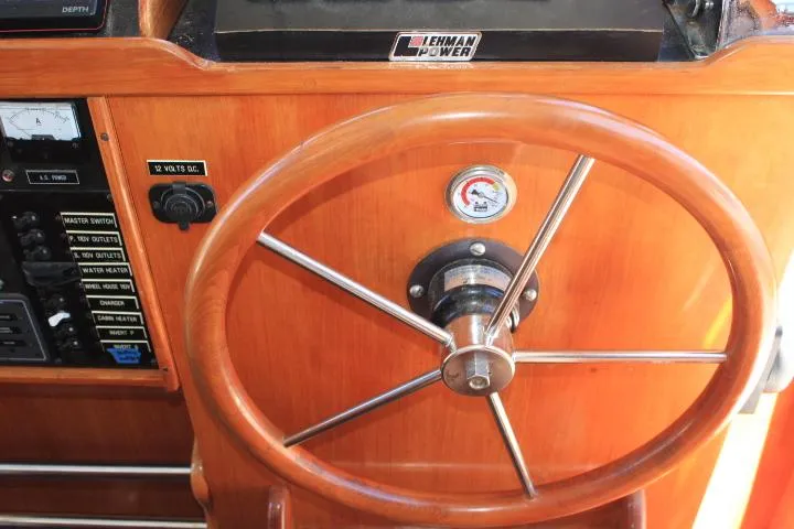 Slide: The Image of 1989 Eagle Pilothouse steering wheel with Lehman Power controls and instrument panel. - 38