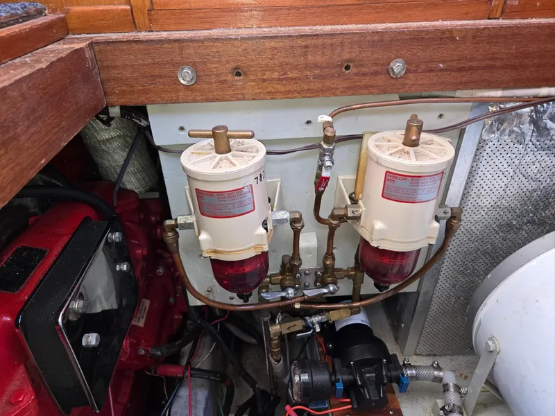 Slide: The Image of Engine room of 1989 Eagle Pilothouse with dual fuel filters and piping system. - 48
