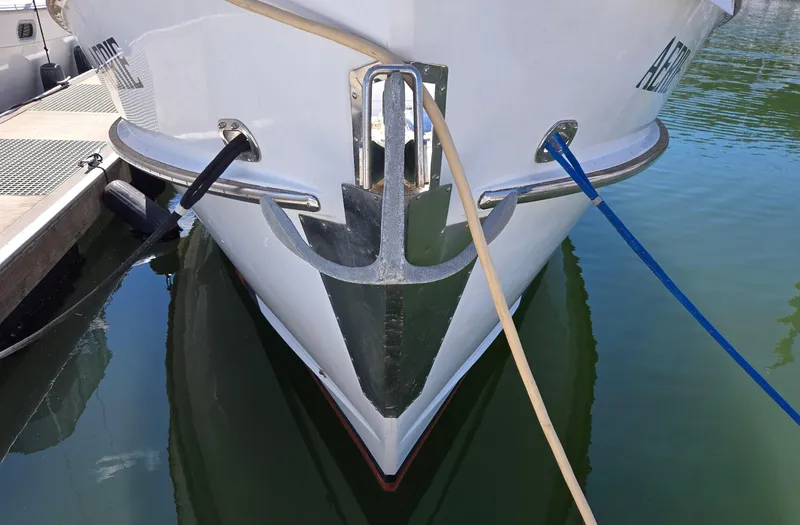 Slide: The Image of Bow of 1989 Eagle Pilothouse yacht with anchor and mooring lines in marina. - 8