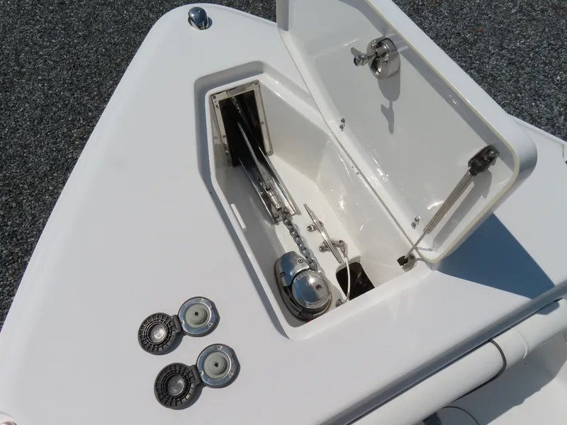 Slide: The Image of Anchor compartment of 2017 Sea Hunt Gamefish 27 boat with open hatch. - 12