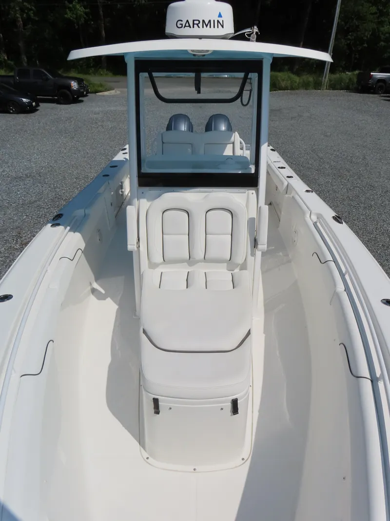 Slide: The Image of 2017 Sea Hunt Gamefish 27 boat with Garmin equipment, featuring spacious seating and sleek design. - 13