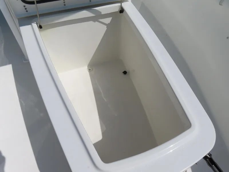 Slide: The Image of 2017 Sea Hunt Gamefish 27 boat storage compartment, open and empty. - 17