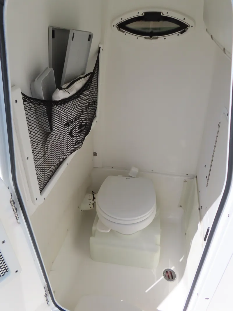 Slide: The Image of Interior of 2017 Sea Hunt Gamefish 27 boat with compact marine toilet. - 20