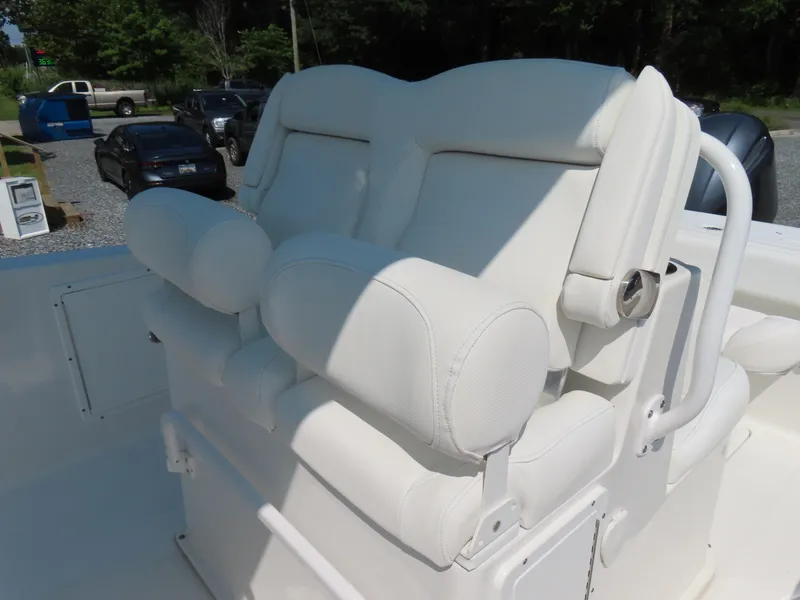 Slide: The Image of 2017 Sea Hunt Gamefish 27 boat with white cushioned seating. - 22