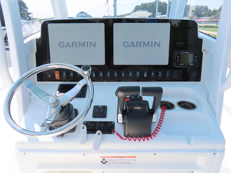Slide: The Image of 2017 Sea Hunt Gamefish 27 helm with Garmin displays and Yamaha controls. - 24