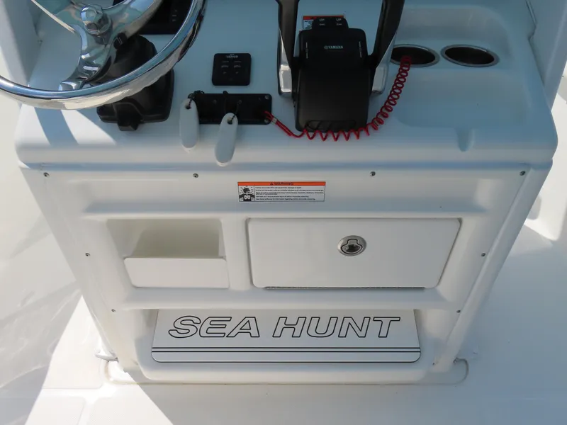 Slide: The Image of 2017 Sea Hunt Gamefish 27 console with steering wheel and controls. - 26