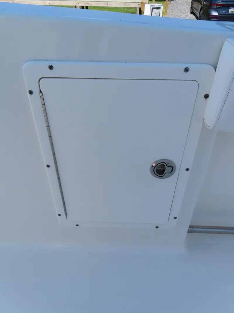 Slide: The Image of 2017 Sea Hunt Gamefish 27 boat compartment with secure latch. - 29