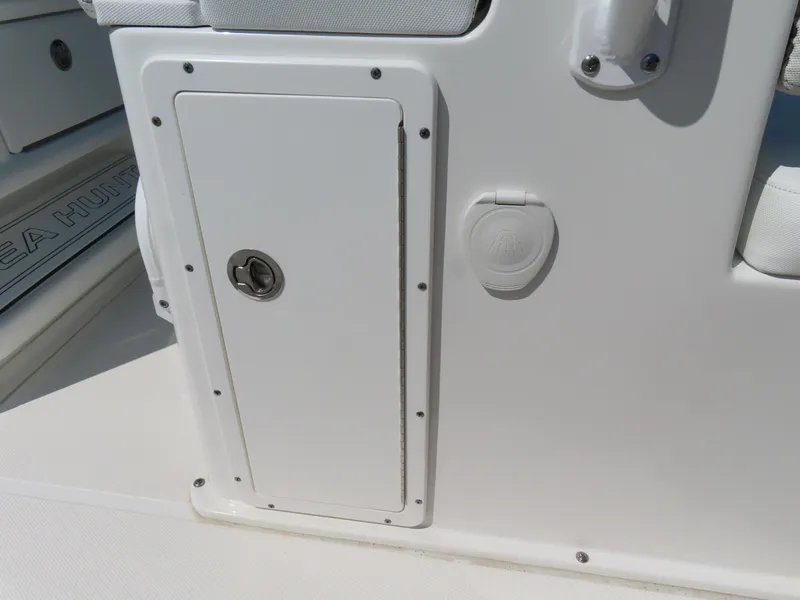 Slide: The Image of 2017 Sea Hunt Gamefish 27 boat storage compartment and deck detail. - 33