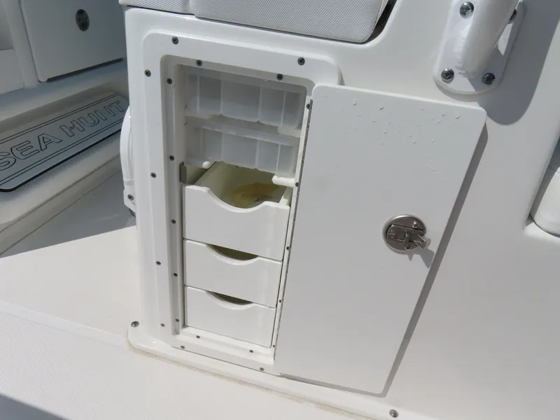 Slide: The Image of 2017 Sea Hunt Gamefish 27 boat storage compartment with drawers and lock. - 34
