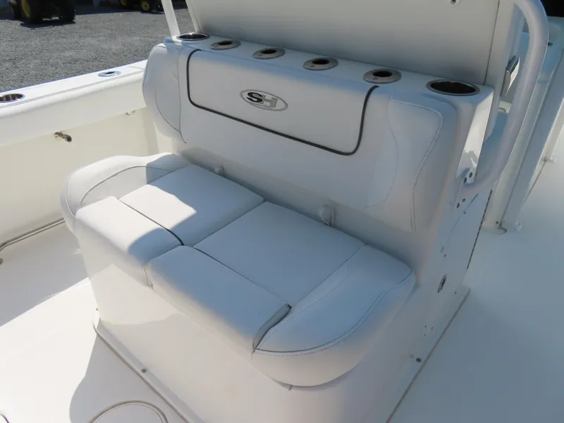Slide: The Image of 2017 Sea Hunt Gamefish 27 boat seating with cup holders and storage. - 35