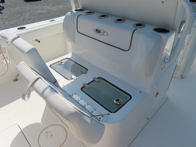 Slide: The Image of 2017 Sea Hunt Gamefish 27 boat seating with storage compartments and cup holders. - 36