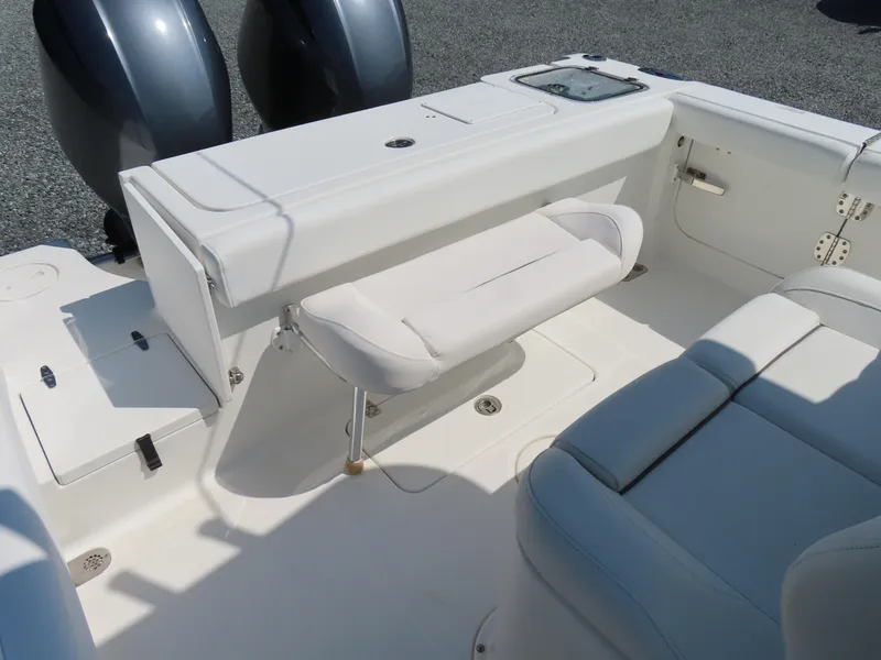 Slide: The Image of 2017 Sea Hunt Gamefish 27 boat interior with seating and dual engines. - 38