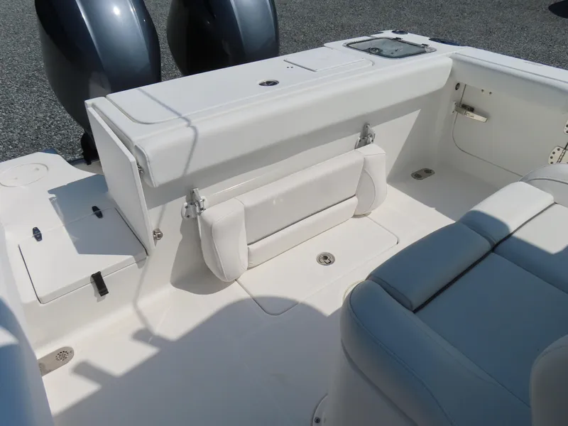 Slide: The Image of 2017 Sea Hunt Gamefish 27 boat interior with seating and dual engines. - 39
