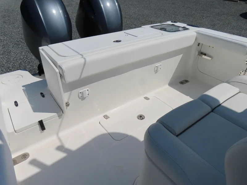 Slide: The Image of 2017 Sea Hunt Gamefish 27 boat interior with seating and dual engines. - 40