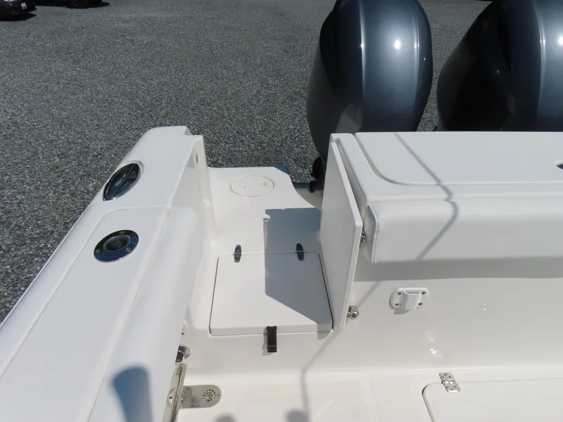 Slide: The Image of 2017 Sea Hunt Gamefish 27 boat interior with dual engines and seating area. - 41