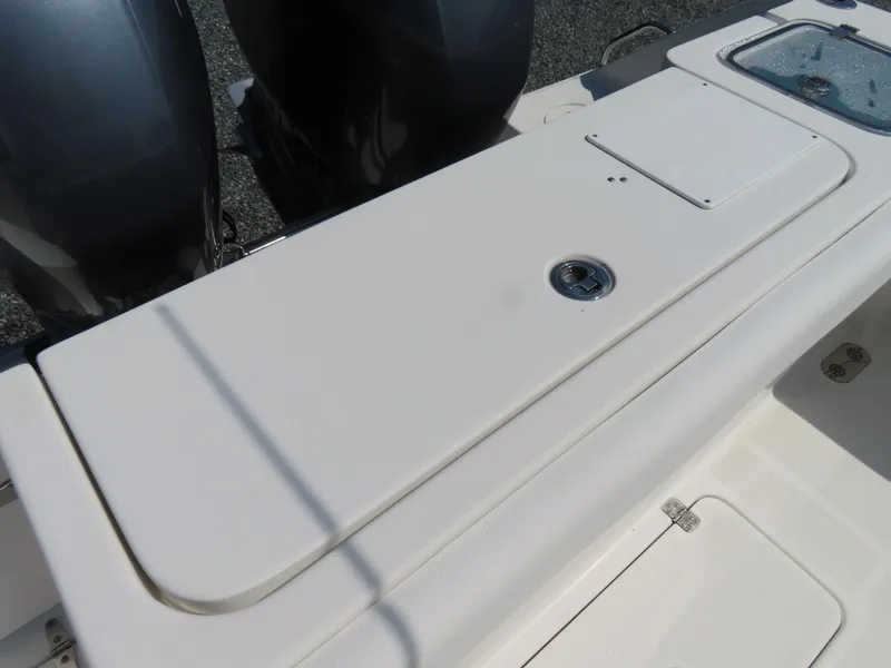 Slide: The Image of 2017 Sea Hunt Gamefish 27 boat deck with dual engines and storage compartments. - 43