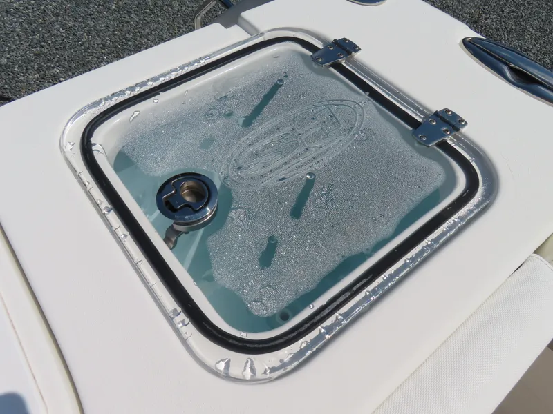 Slide: The Image of Livewell on 2017 Sea Hunt Gamefish 27 boat, featuring a clear lid with condensation. - 46