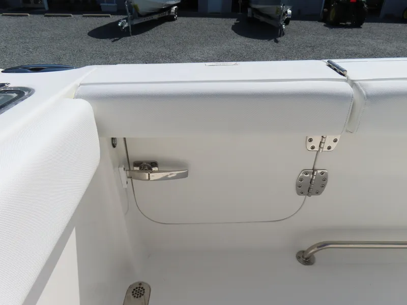 Slide: The Image of 2017 Sea Hunt Gamefish 27 boat interior with white seating and stainless steel hardware. - 48
