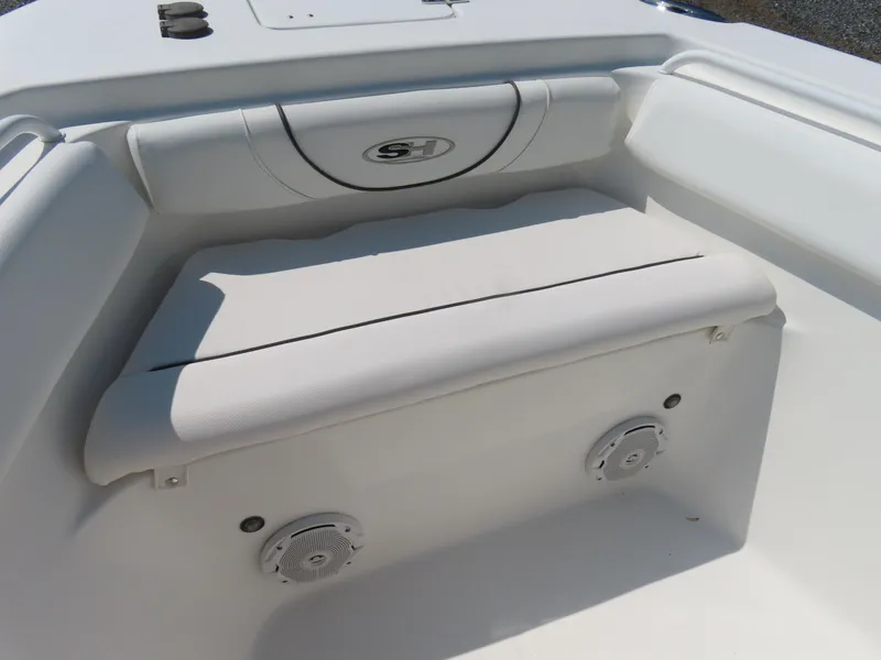 Slide: The Image of 2017 Sea Hunt Gamefish 27 boat interior with cushioned seating and built-in speakers. - 8