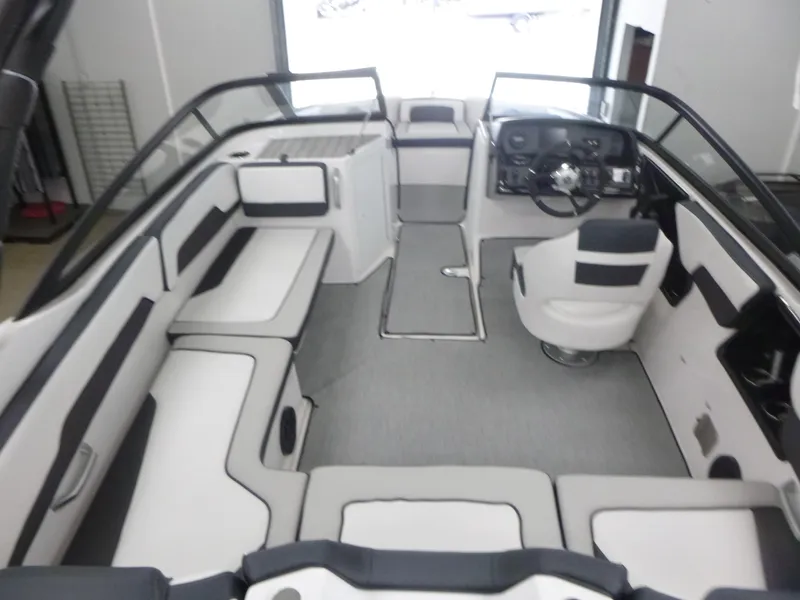 Slide: The Image of 2025 Yamaha Boats AR195 interior with sleek seating and modern dashboard design. - 5
