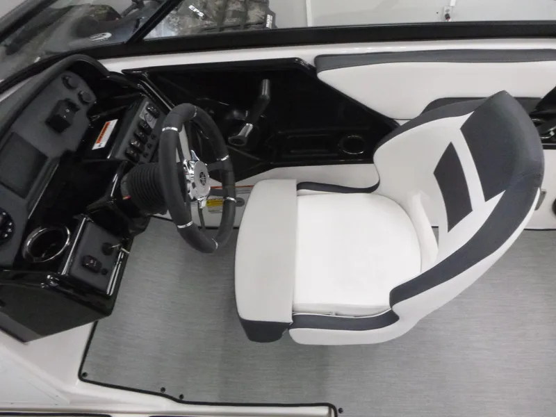 Slide: The Image of 2025 Yamaha Boats AR195 cockpit with modern steering wheel and comfortable seating. - 7