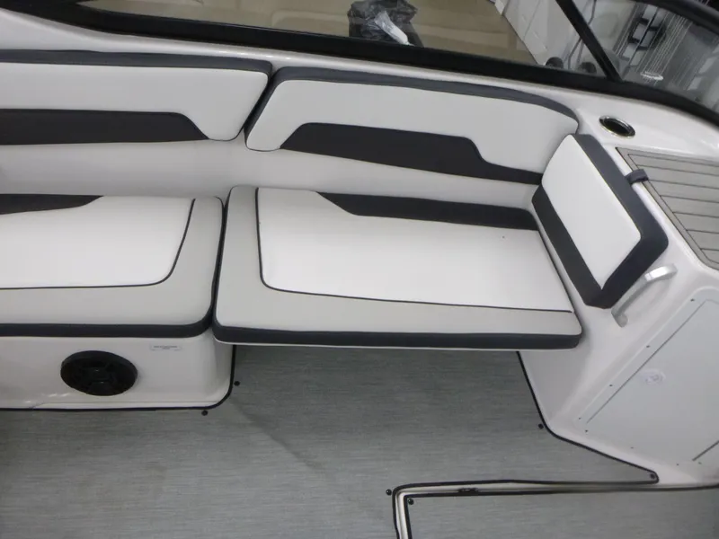 Slide: The Image of 2025 Yamaha AR195 boat interior with sleek white and black seating. - 9