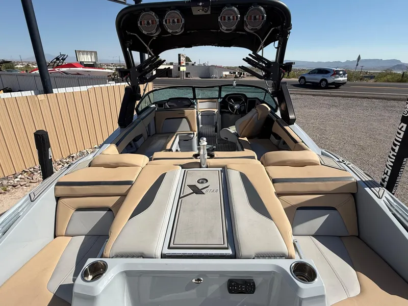 Slide: The Image of 2022 MasterCraft XStarS boat interior with beige seating and modern design. - 10