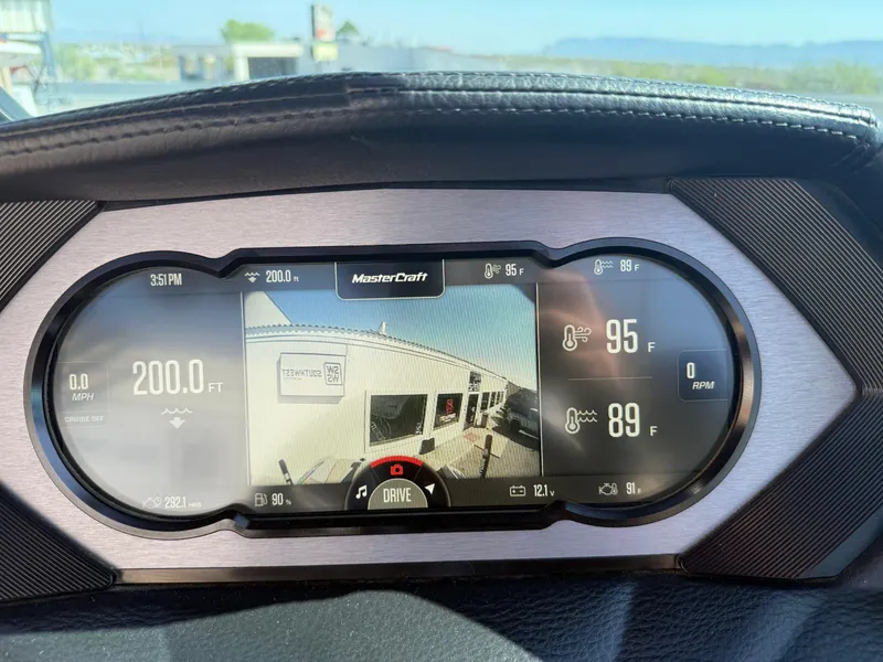 Slide: The Image of Dashboard of a 2022 MasterCraft XStarS boat displaying speed, temperature, and camera view. - 11