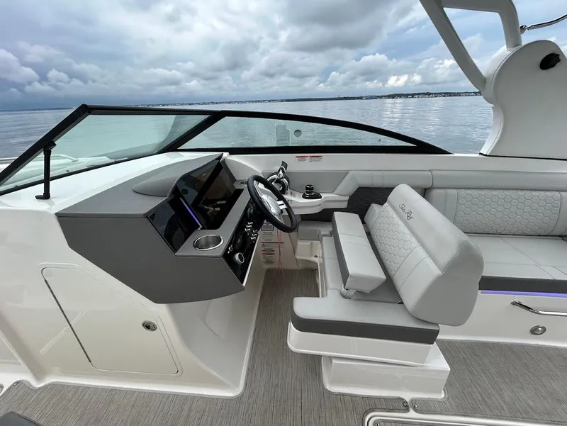 Slide: The Image of 2020 Sea Ray SDX 290 Outboard boat interior with modern helm and seating. - 14