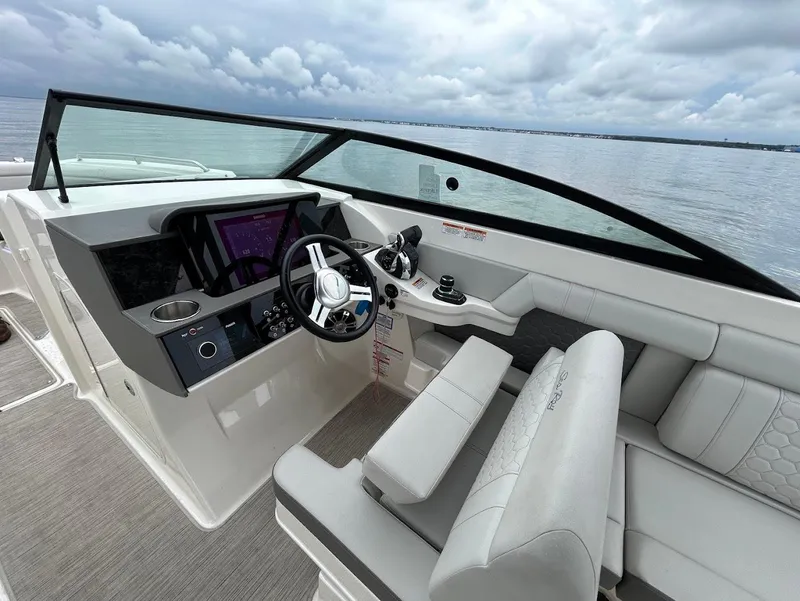 Slide: The Image of 2020 Sea Ray SDX 290 Outboard boat interior with modern helm and seating. - 15