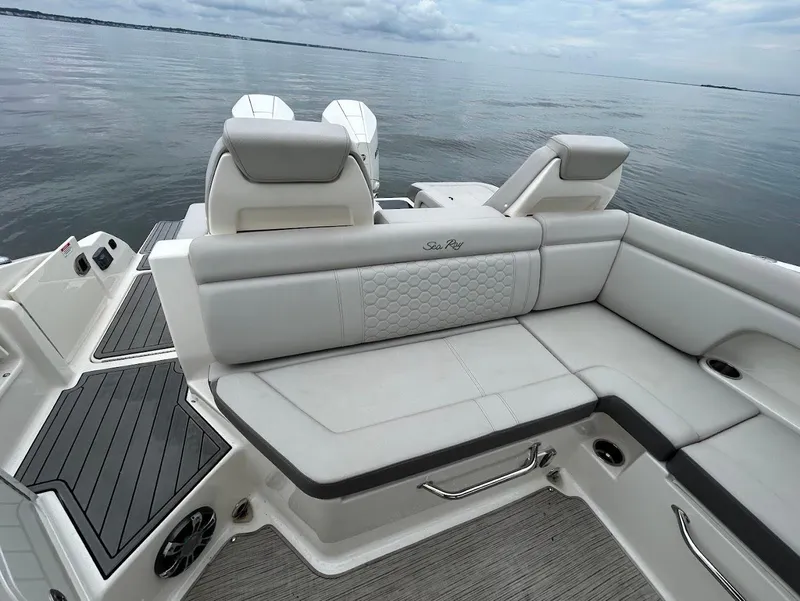 Slide: The Image of 2020 Sea Ray SDX 290 Outboard boat interior with luxurious seating and scenic water view. - 24