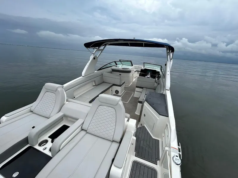 Slide: The Image of 2020 Sea Ray SDX 290 Outboard boat with spacious seating on calm waters. - 27