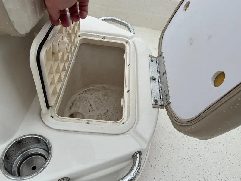 Slide: The Image of Open storage compartment on a 2014 Carolina Skiff 218 DLV boat. - 15