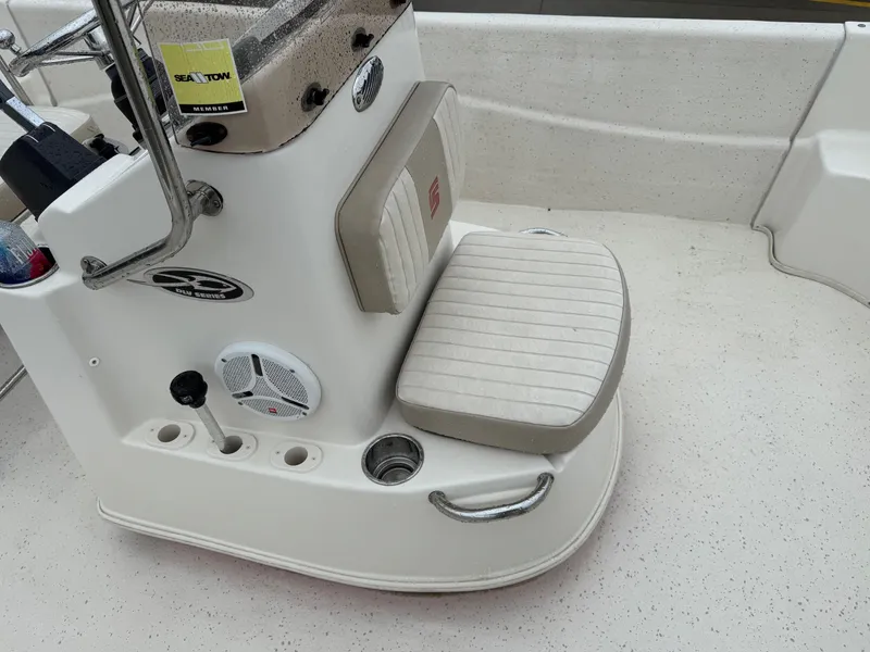 Slide: The Image of 2014 Carolina Skiff 218 DLV boat interior with seating and control panel. - 16