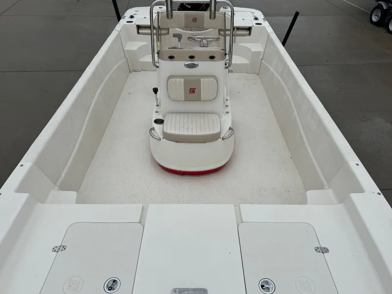 Slide: The Image of 2014 Carolina Skiff 218 DLV boat interior with center console and seating. - 18