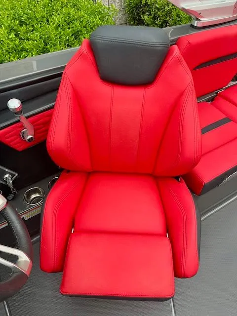 Slide: The Image of Red and black seat in 2021 MasterCraft X24 boat interior. - 12