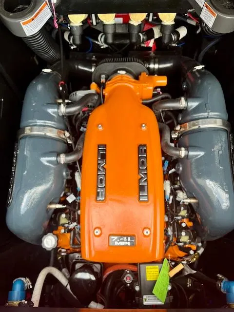 Slide: The Image of 2021 MasterCraft X24 engine, Ilmor 7.4L, vibrant orange and gray components. - 18